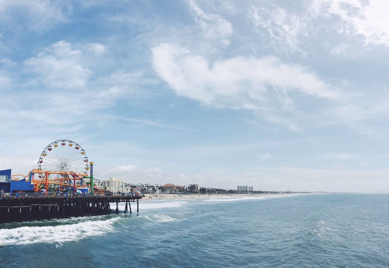 The Santa Monica Pier and its Ferris wheel seen from the water