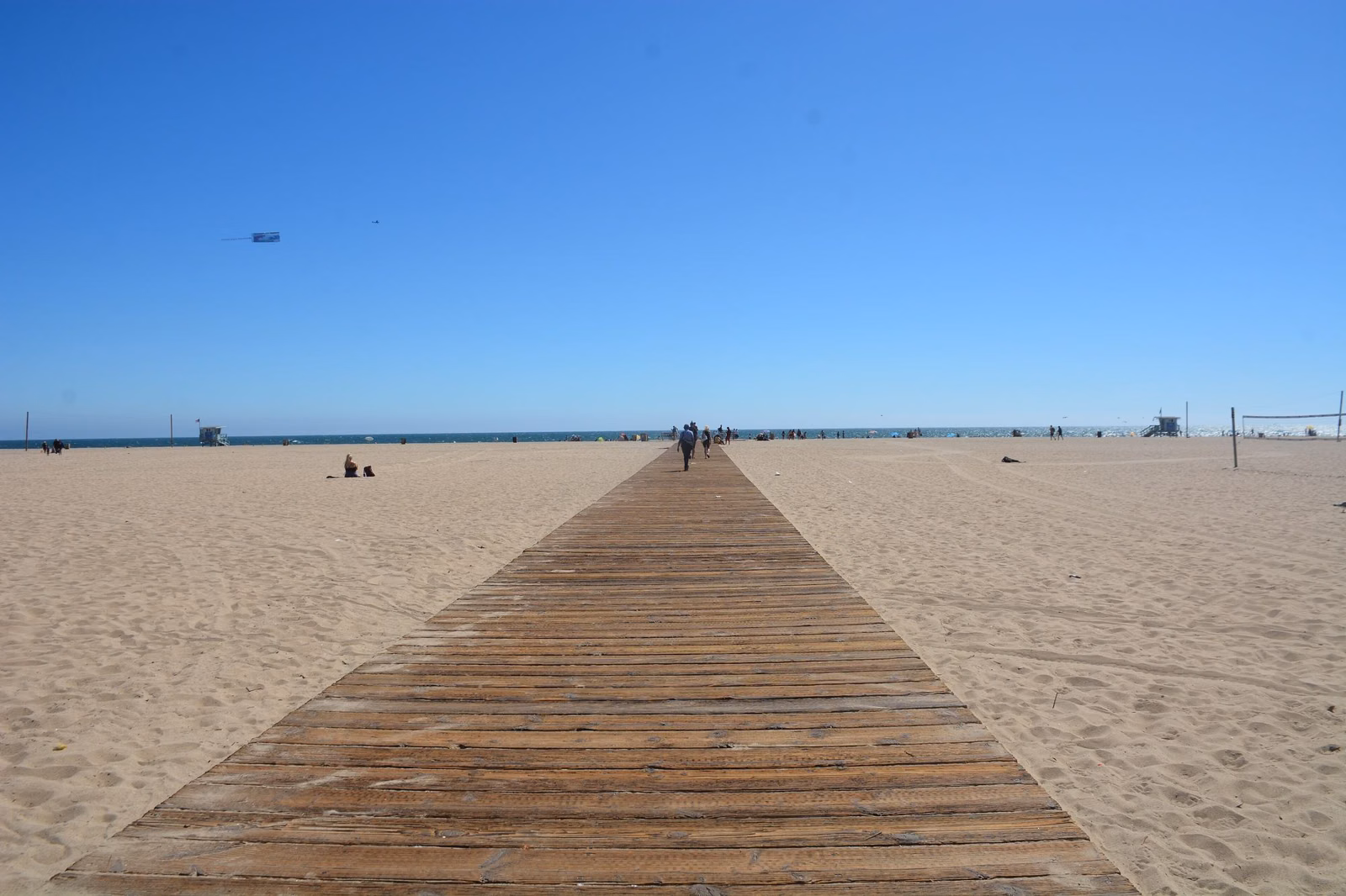 A wooden walkway across the sand at Santa Monica State Beach
