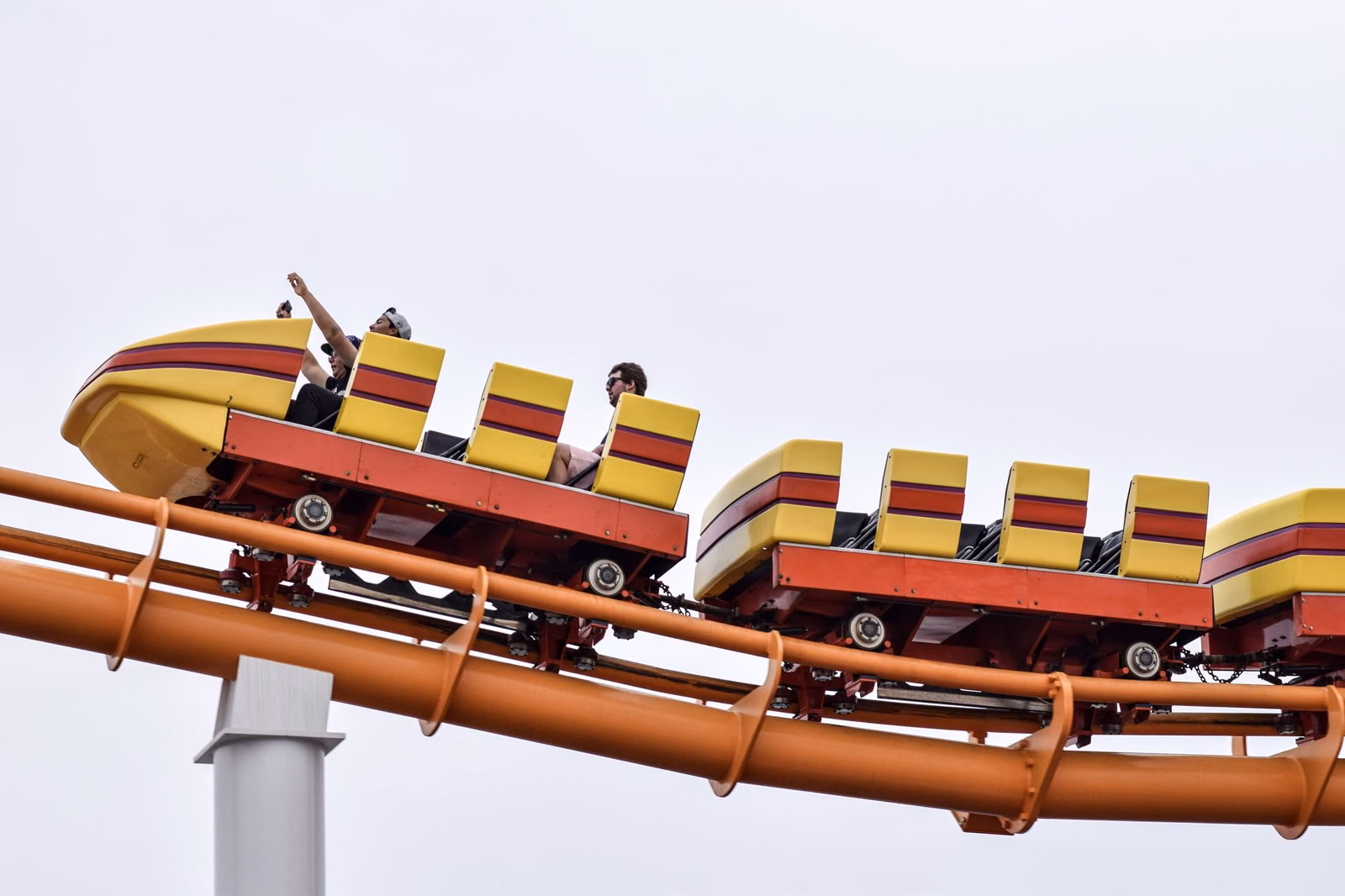 Riders on Pacific Park's roller coaster on the Santa Monica Pier