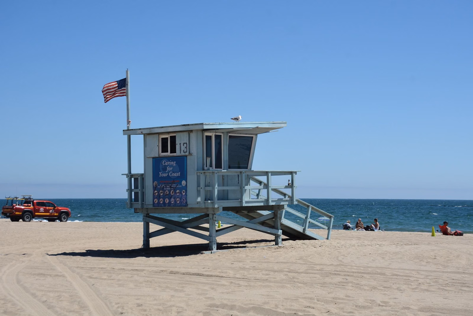 A lifeguard tower with a flag on Santa Monica State Beach